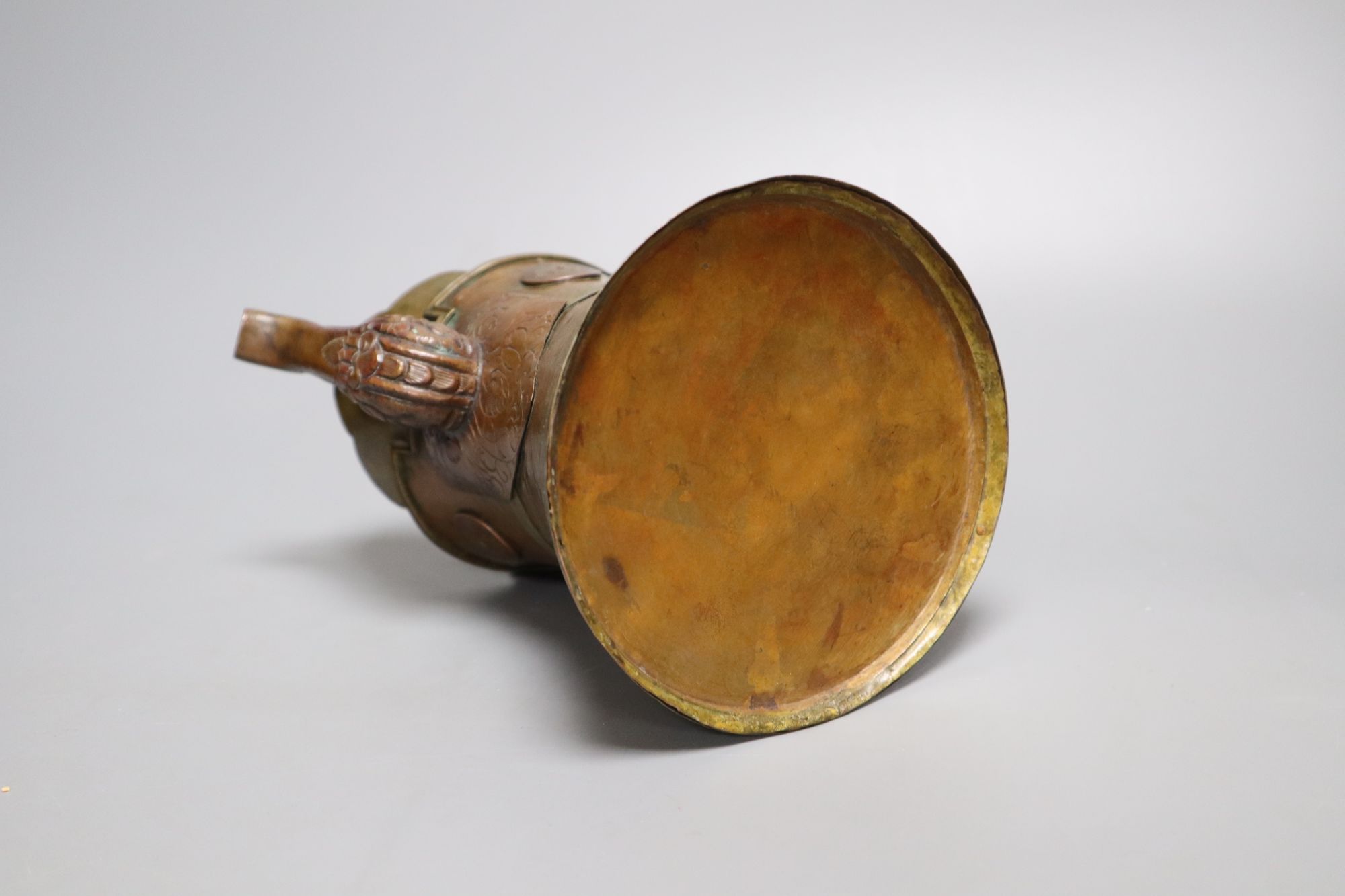 A Himalayan copper and brass teapot, height 20cm